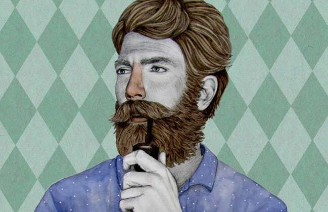 hombre con barba fumando en pipa