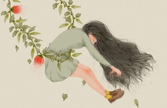 mujer suspendida en un columpio