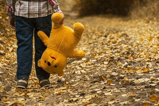 child with teddy
