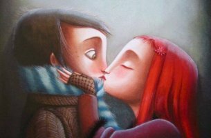 Niña con el pelo rojo besando a un niño