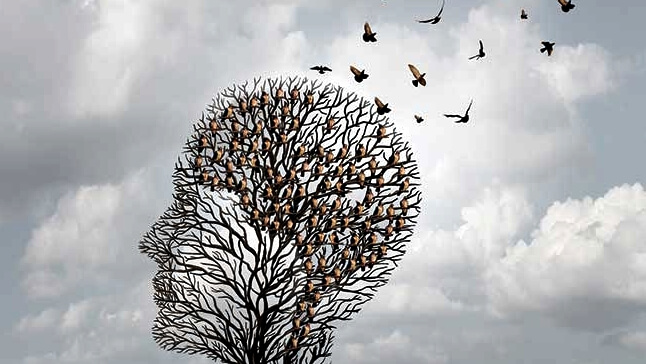 árbol con forma de cabeza del que escapan pájaros