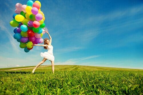 playful woman with balloons