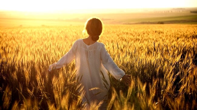 Woman in wheat field.
