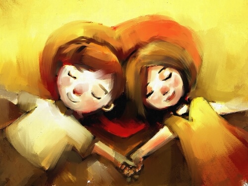 Pareja tumbada sobre un corazón agarrada de la mano