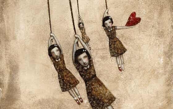 dolls hanging from strings