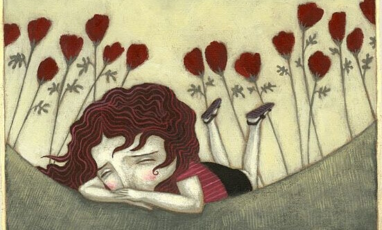 Niña triste rodeada de flores