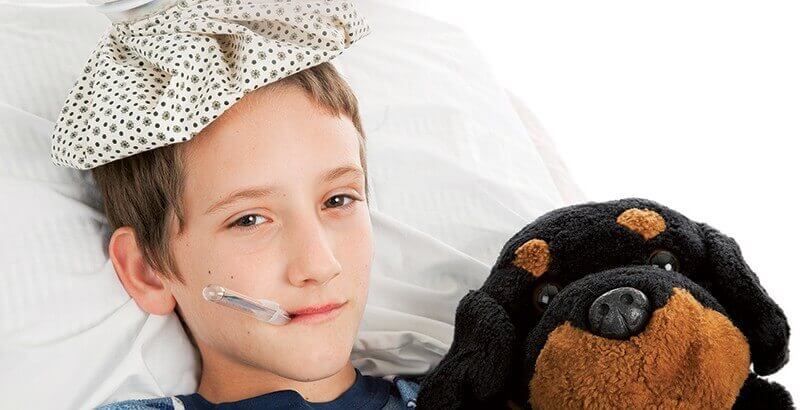 Niño con termómetro