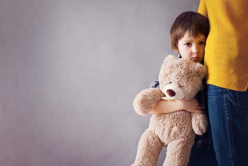 boy holding teddy bear