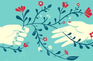 manos con flores representando la terapia centrada en la compasión