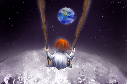 Niña en un columpio sobre la luna
