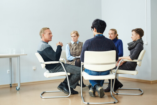 Group of psychologists gathered at the college of psychologists talk about reducing stigma in mental health