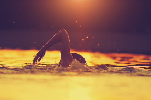 A person swimming as a sport.
