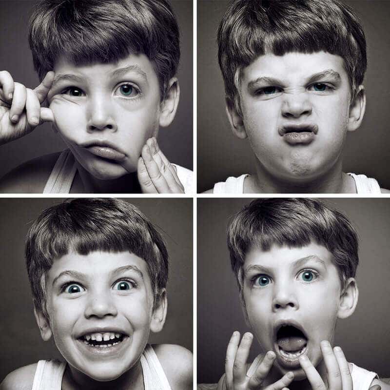 Niño con diferentes caras expresando emociones