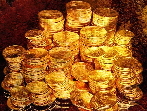 monedas de oro simbolizando el el círculo del 99