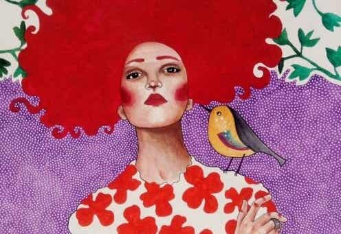 mujer con pájaro simbolizando los rasgos de las personas emocionalmente fuertes