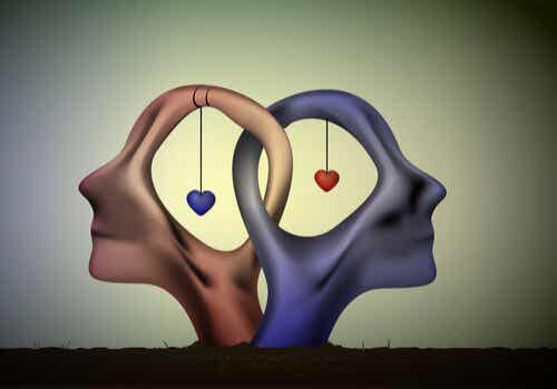 Dos cabezas de una pareja con corazones unidas para representar los juegos psicológicos