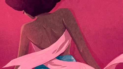 mujer con lazo rosa simbolizando el cáncer de mama