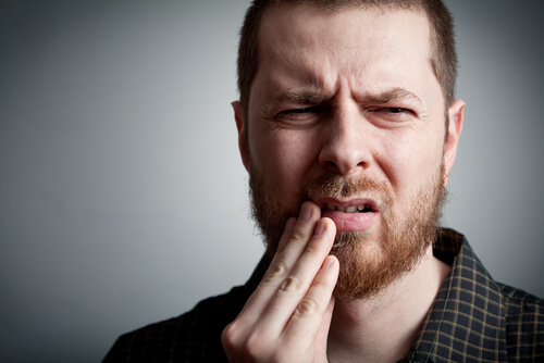 Man with pain in his mouth
