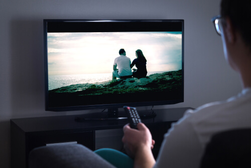 Man watching an ad on tv