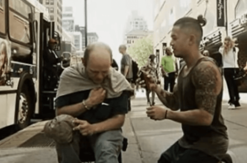 Mark Bustos combing in the street