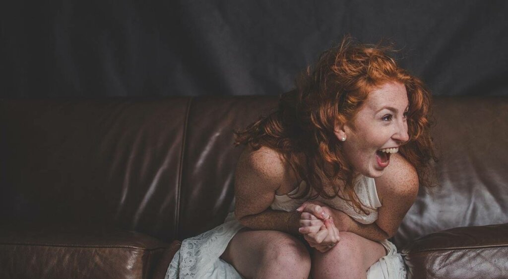 Girl laughing and wondering why am I like this?