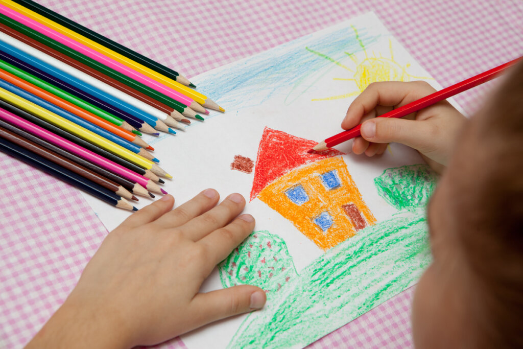 Niño dibujando la casita de casita de Vanistendael