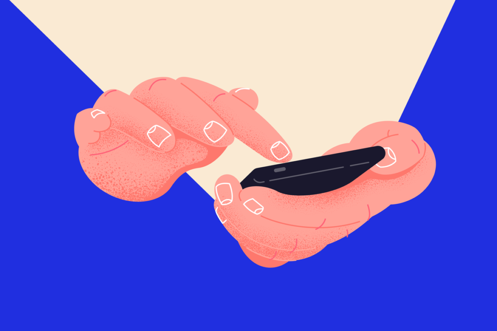 Persona manipula un móvil construyendo su status virtual