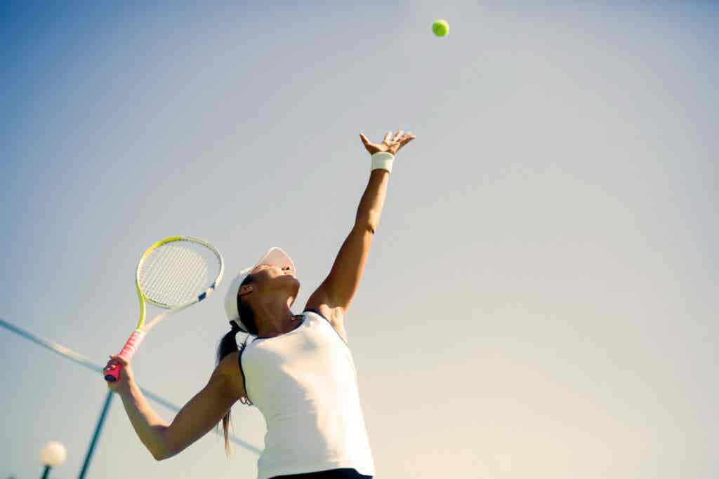 girl playing tennis thinking about swearing