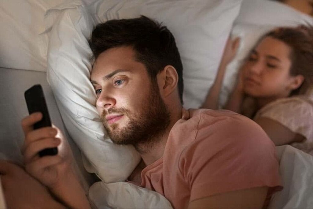 Man practicing digital infidelity