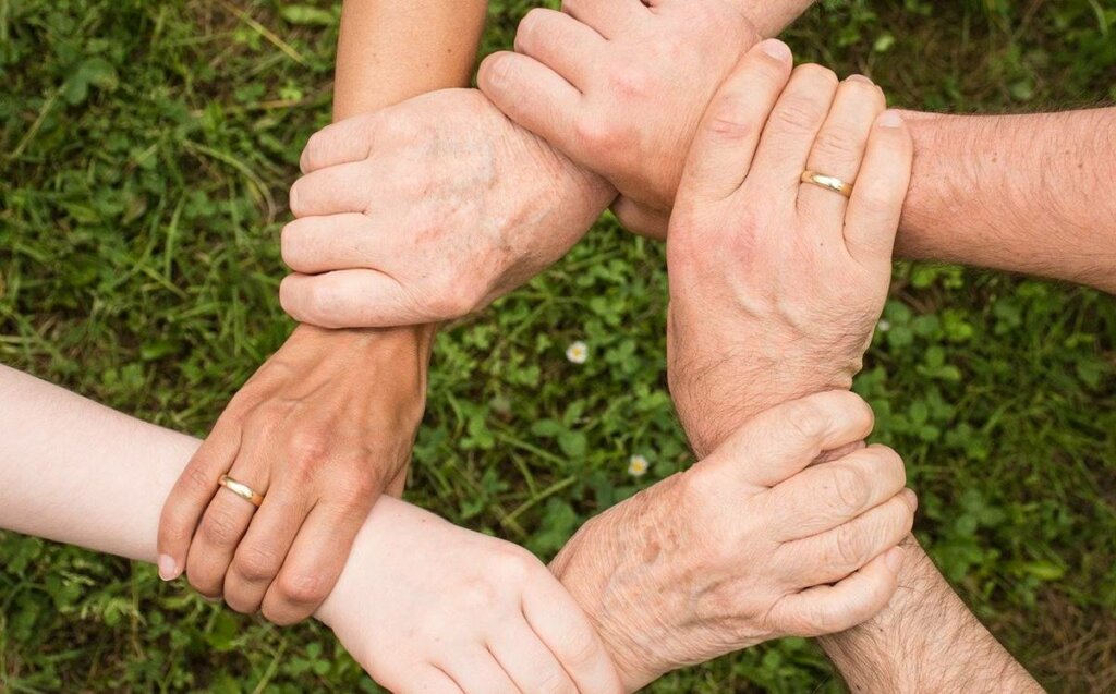 Joined hands representing the question of why my family always fights if you will