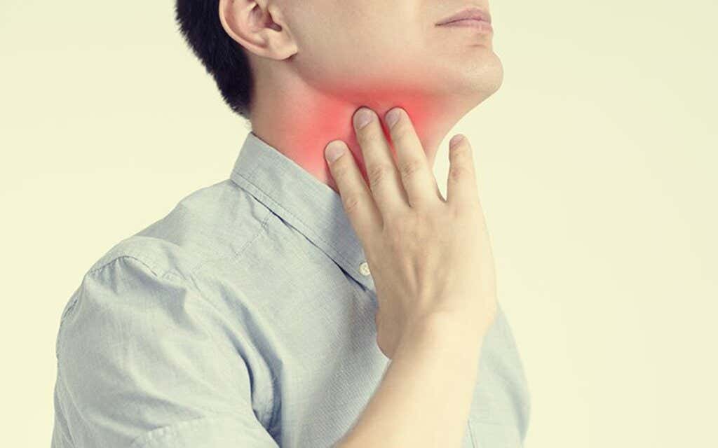 Man suffering from stress sore throat