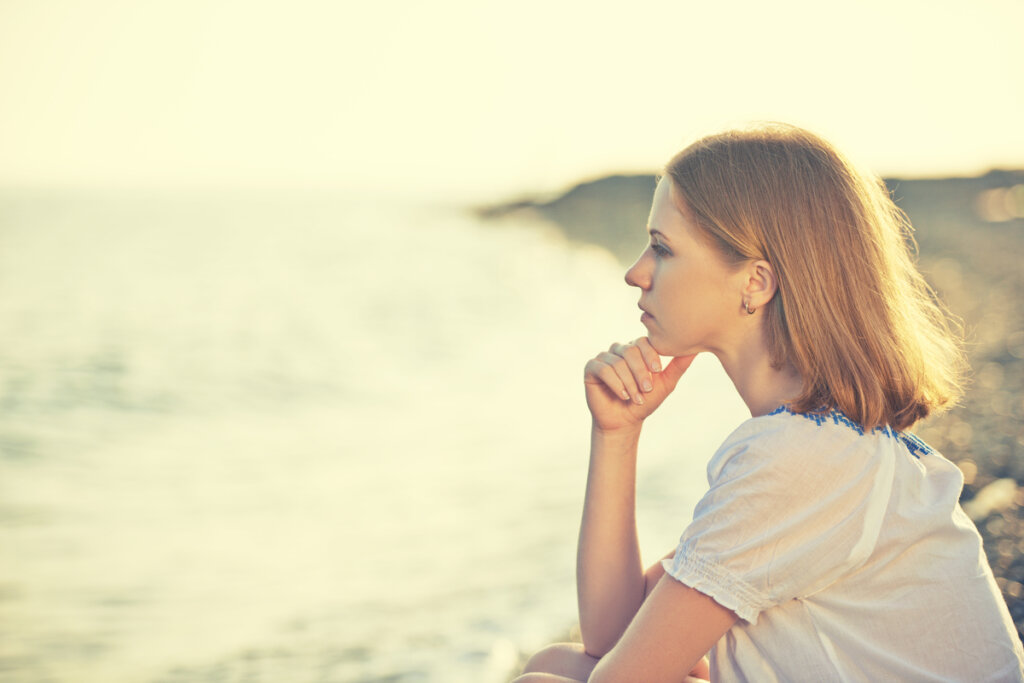 Woman pondering the philosophical questions to think about