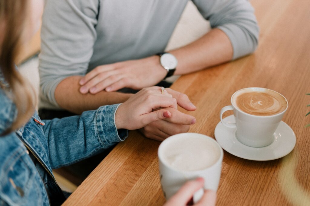 Couple talking and having coffee.