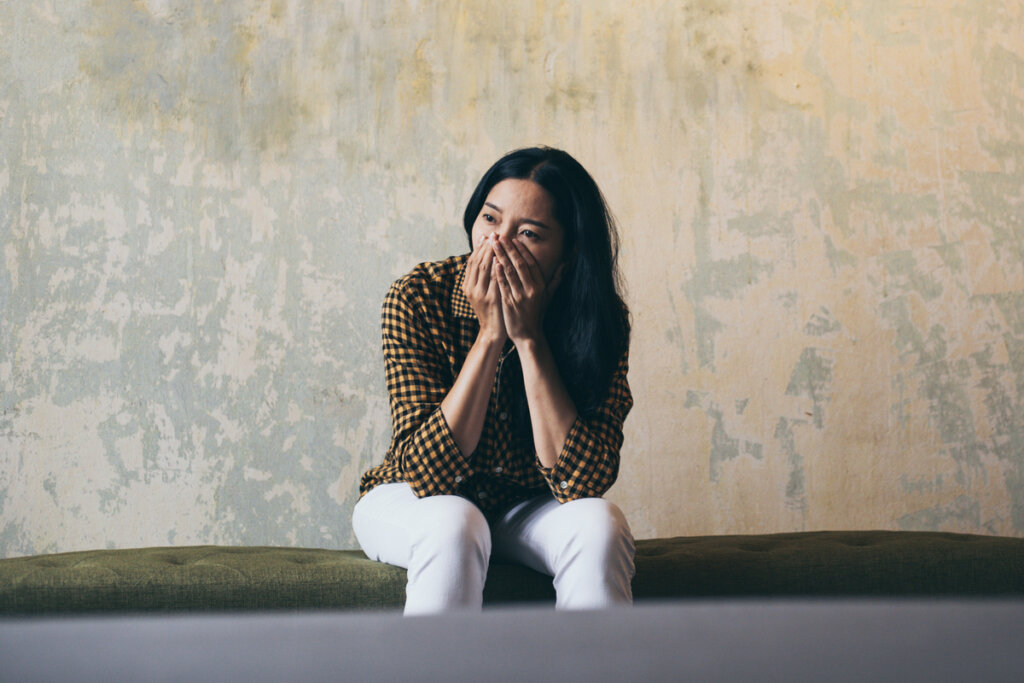 Woman with fear due to persecution mania