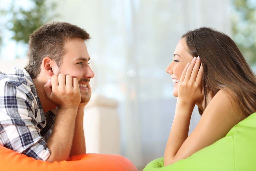 Couple looking at each other happy to have an optimistic partner