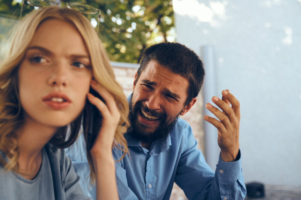 Man criticizing woman harshly