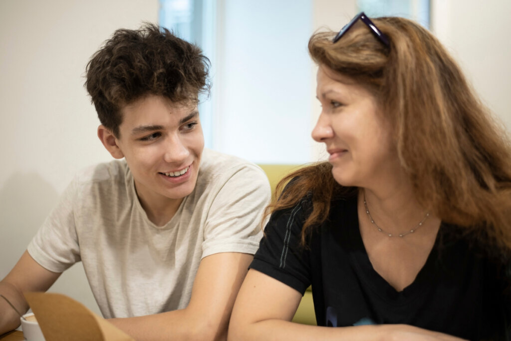 Mother talking to her son representing what teens need.