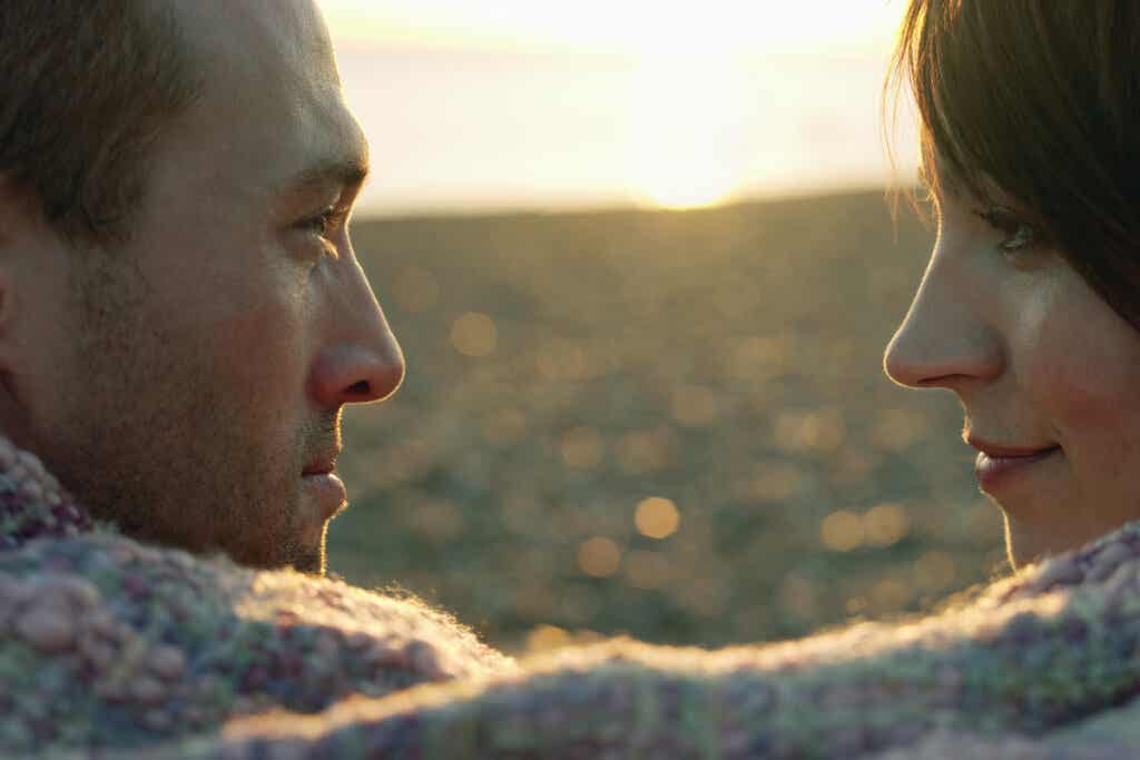 Couple looking into the distance representing how childhood traumas affect a couple's relationship