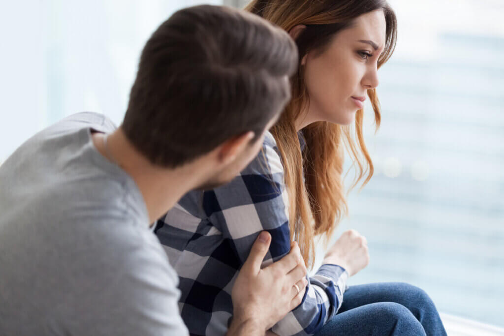 Man trying to help a woman