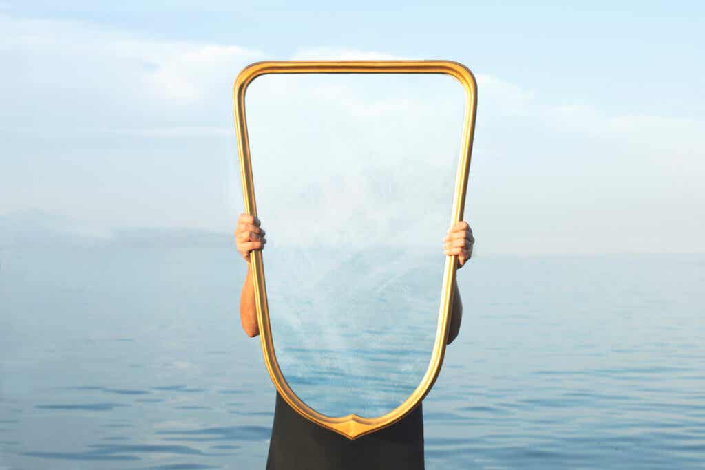 Person holding mirror