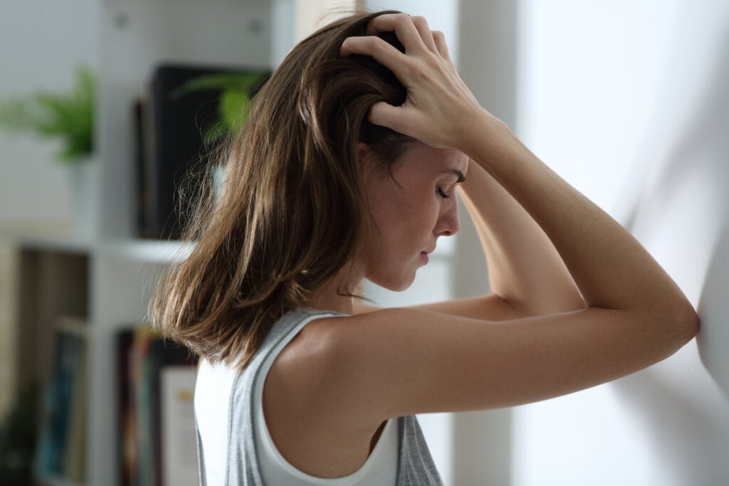 Woman suffering from menstrual migraine