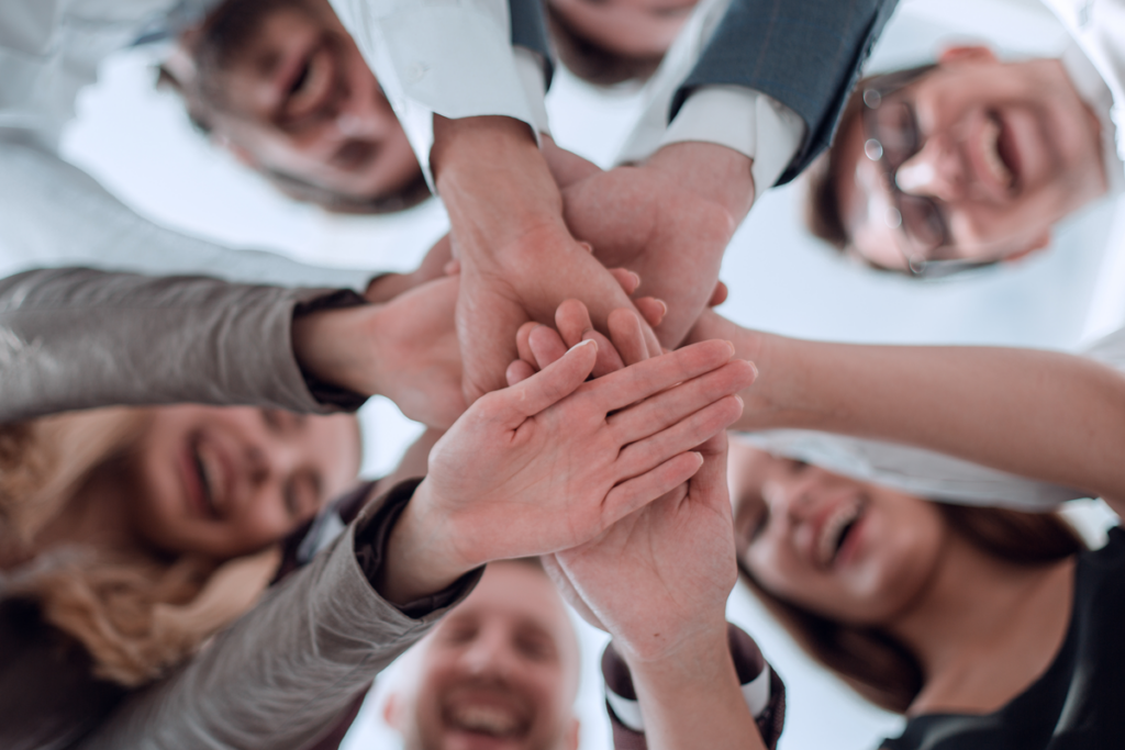 People joining their hands symbolizing ubuntu