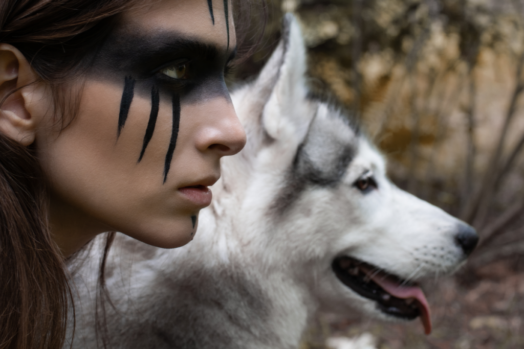 Face of a woman with a wolf to represent the archetype of the wild woman