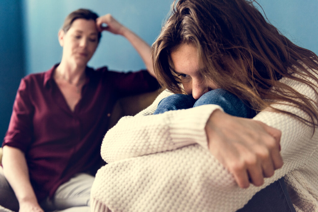 Angry teenager with her mother