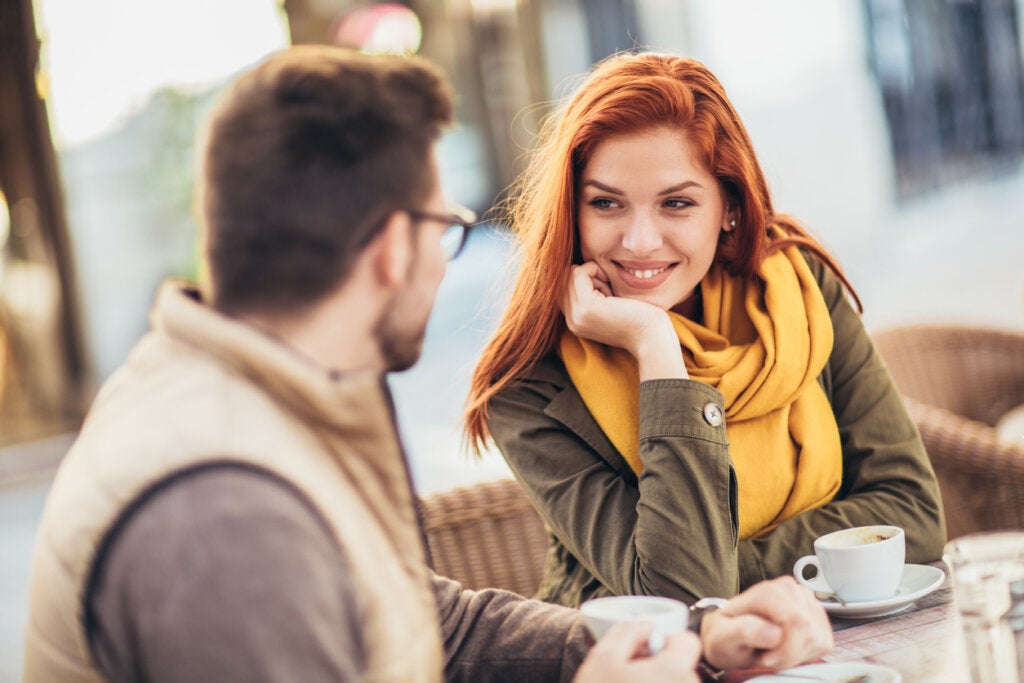 Couple smiling, thinking about how to identify attachment styles