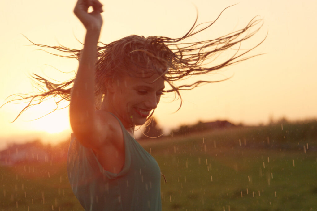 Woman dancing in the rain