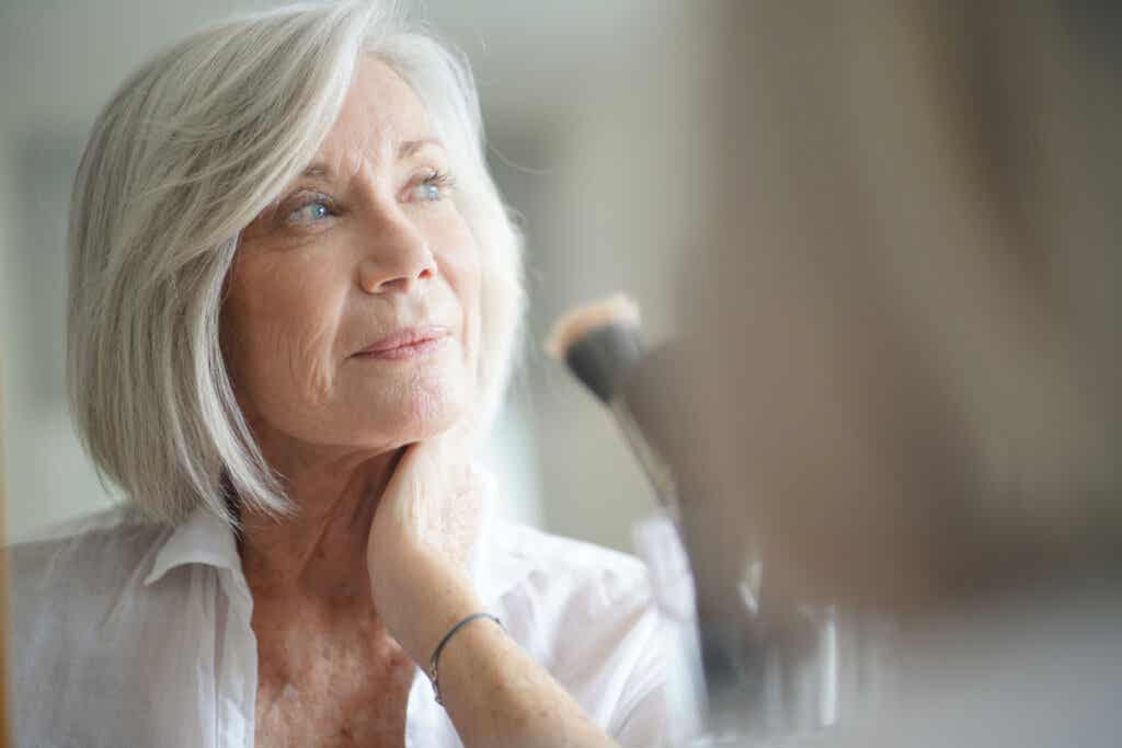 Senior woman looking at a mirror