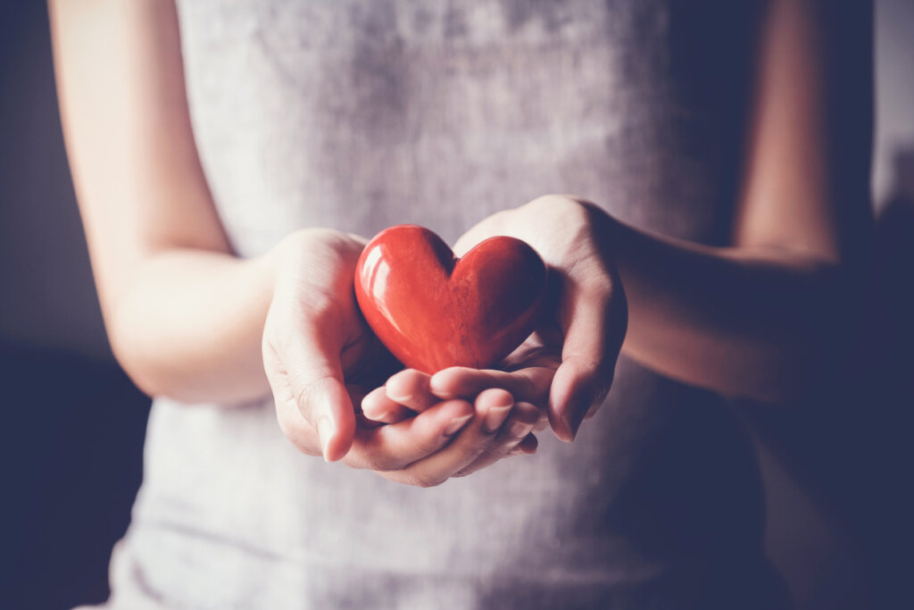 Woman with heart in hands