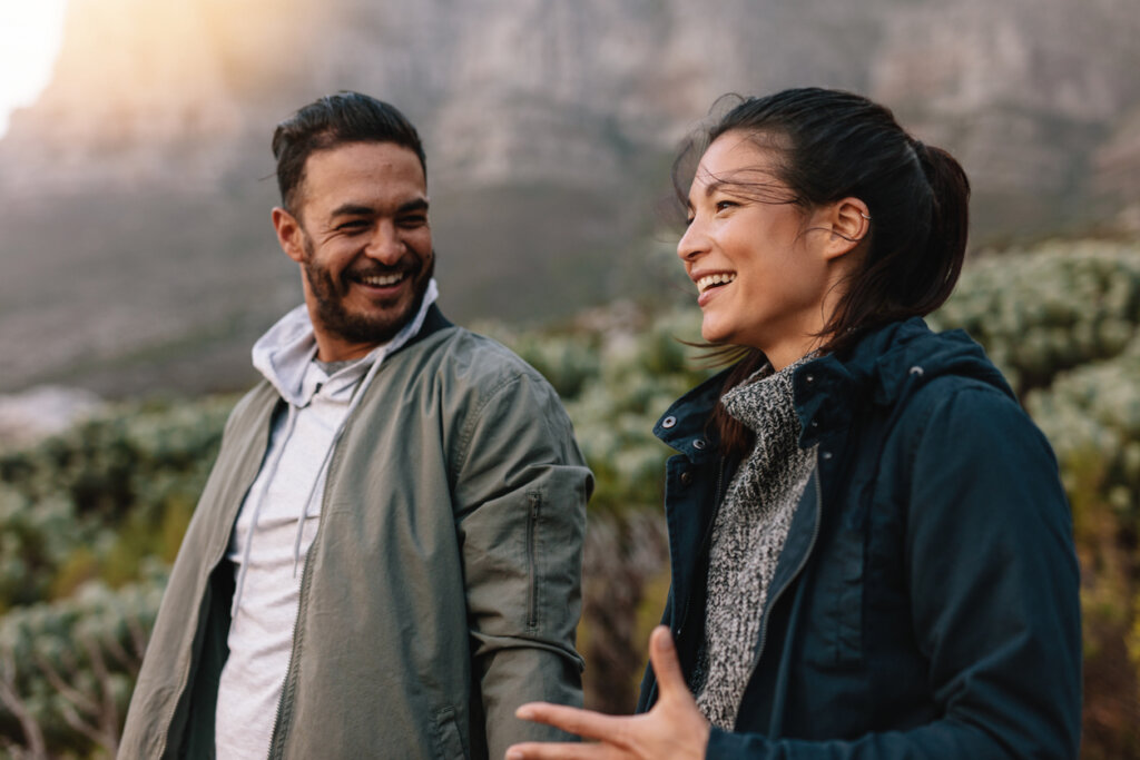 Man and woman talking outdoors