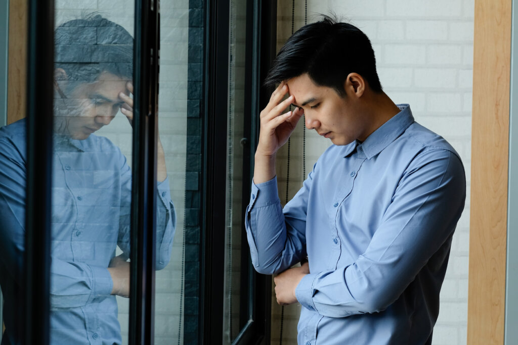 Sad man at the window